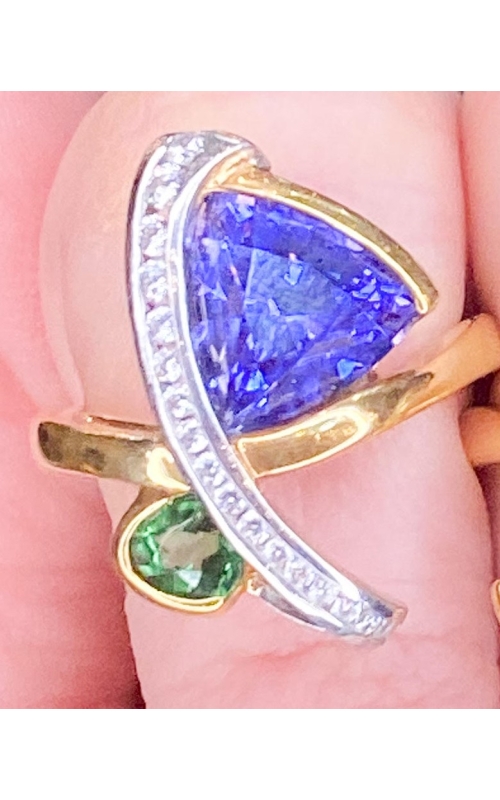 2.61ct Tanzanite and .46ct tsavorite with .20cts of diamonds.  18k yellow gold